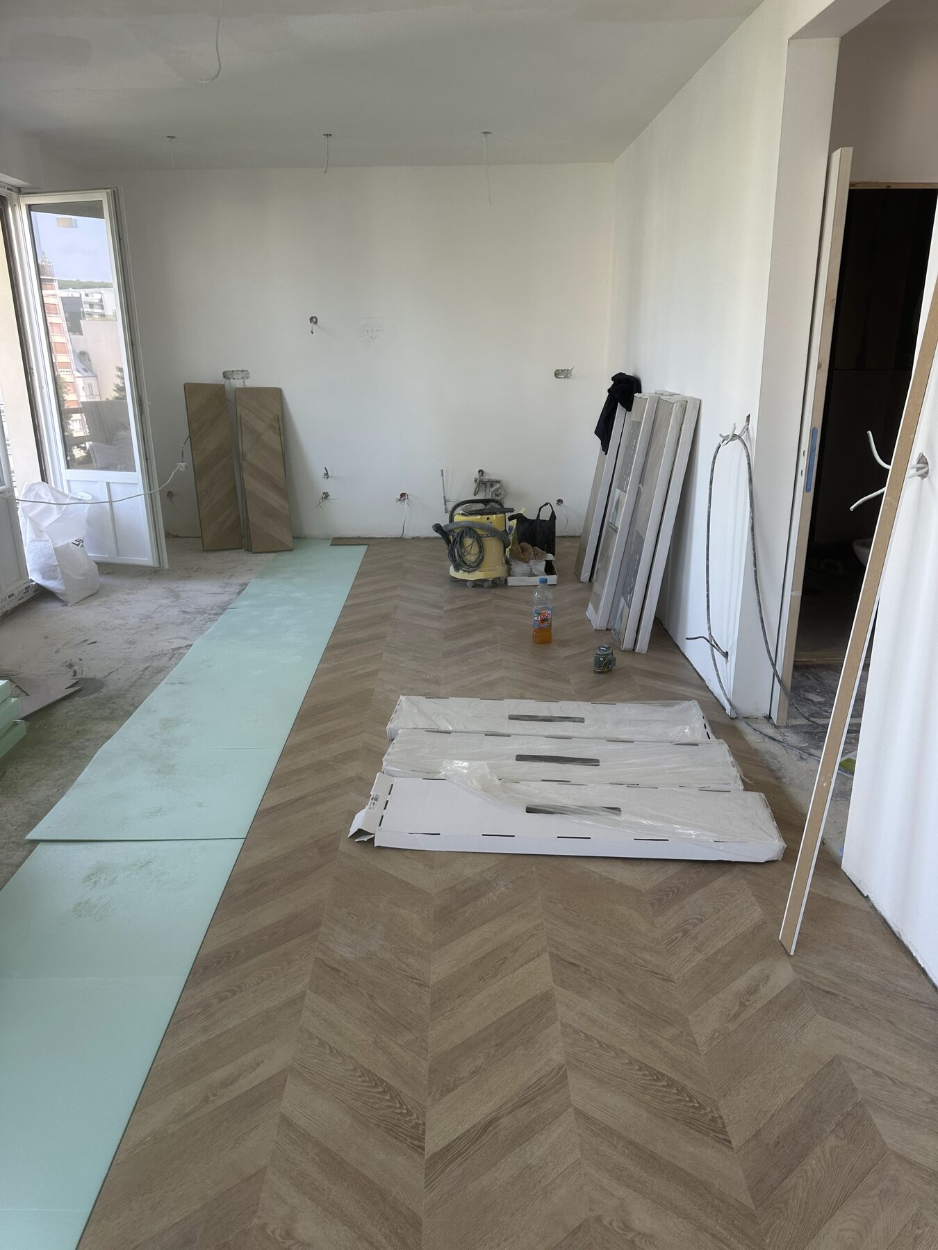 Pose et protection du parquet pendant le chantier